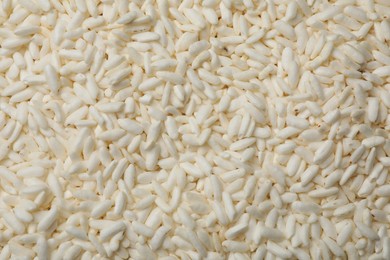 Photo of Wholegrain puffed rice as background, closeup view