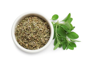 Photo of Dried oregano in bowl and green leaves isolated on white, top view