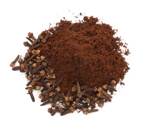 Pile of clove powder and dried buds on white background, top view. Aromatic spice