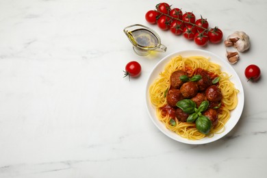 Photo of Delicious pasta with meatballs and ingredients on white marble table, flat lay. Space for text