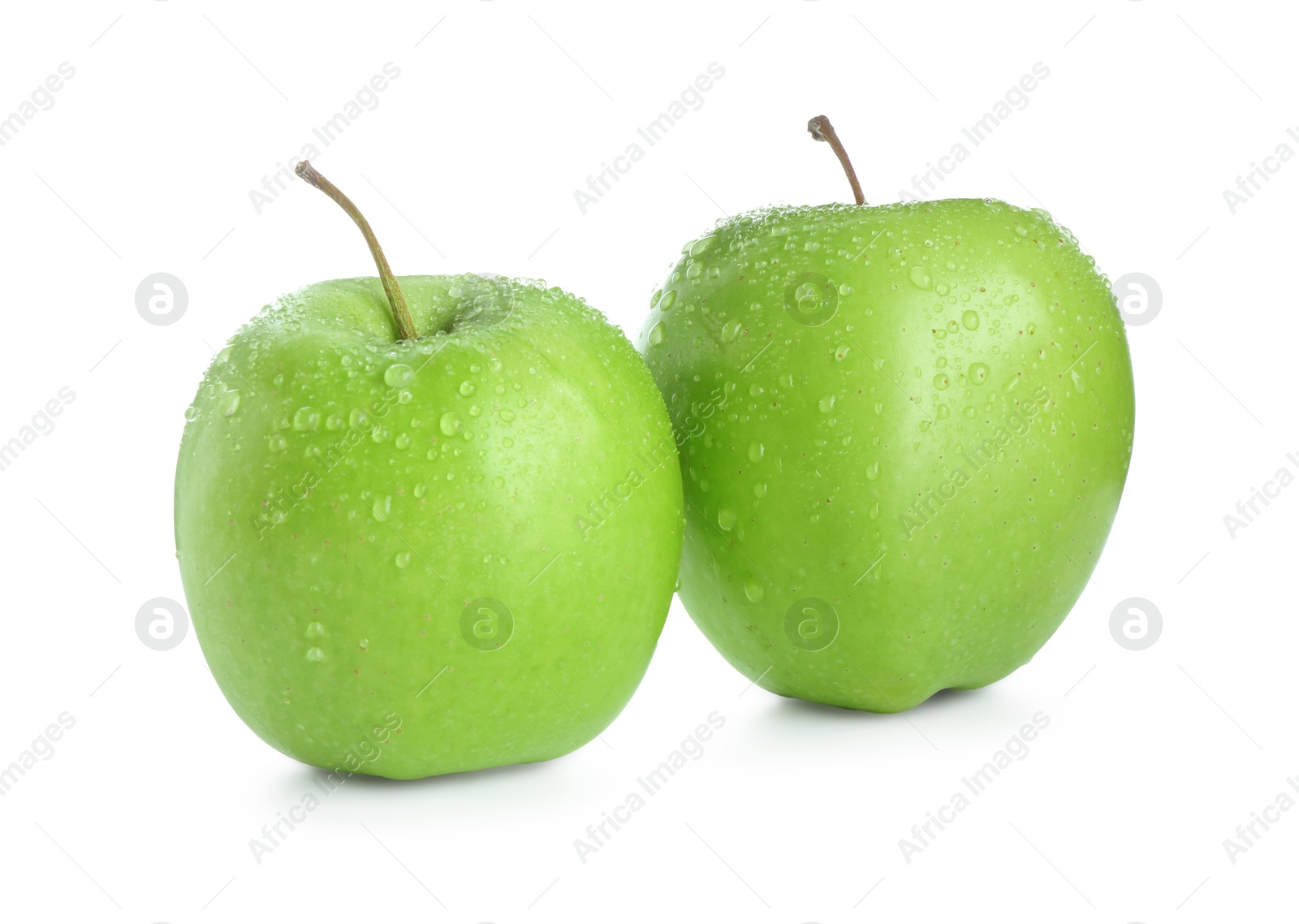 Photo of Two fresh green apples isolated on white