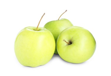 Photo of Three fresh green apples isolated on white