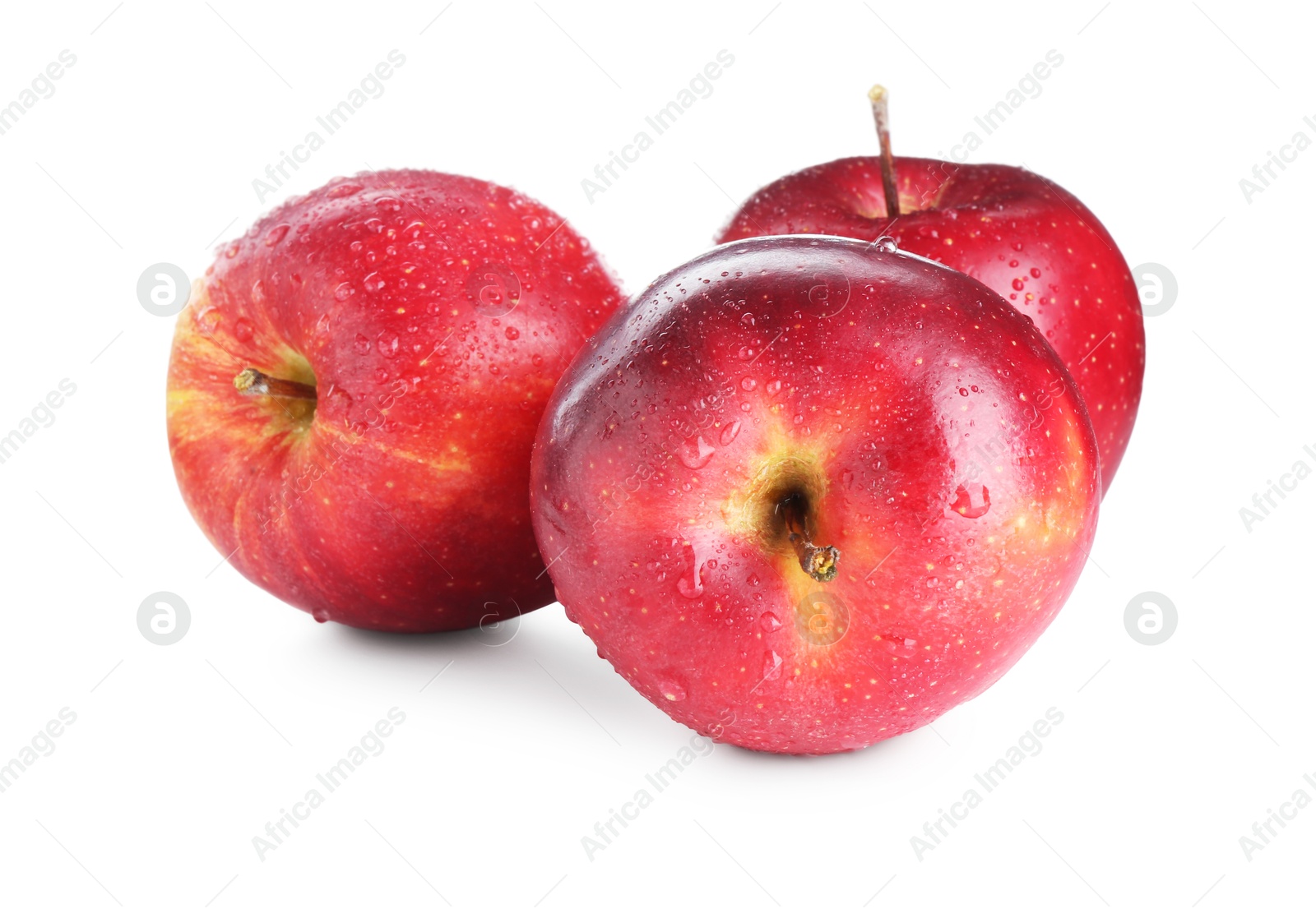 Photo of Three fresh red apples isolated on white