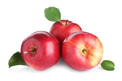 Photo of Many fresh red apples and green leaves isolated on white