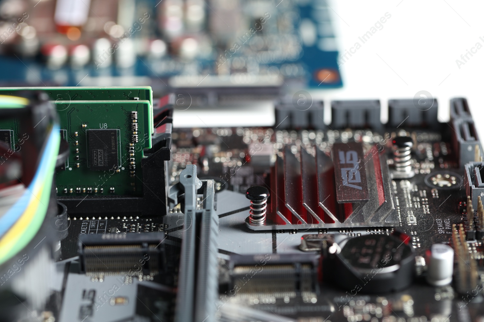 Photo of Computer motherboard with RAM chip as background, closeup. Electronic engineering