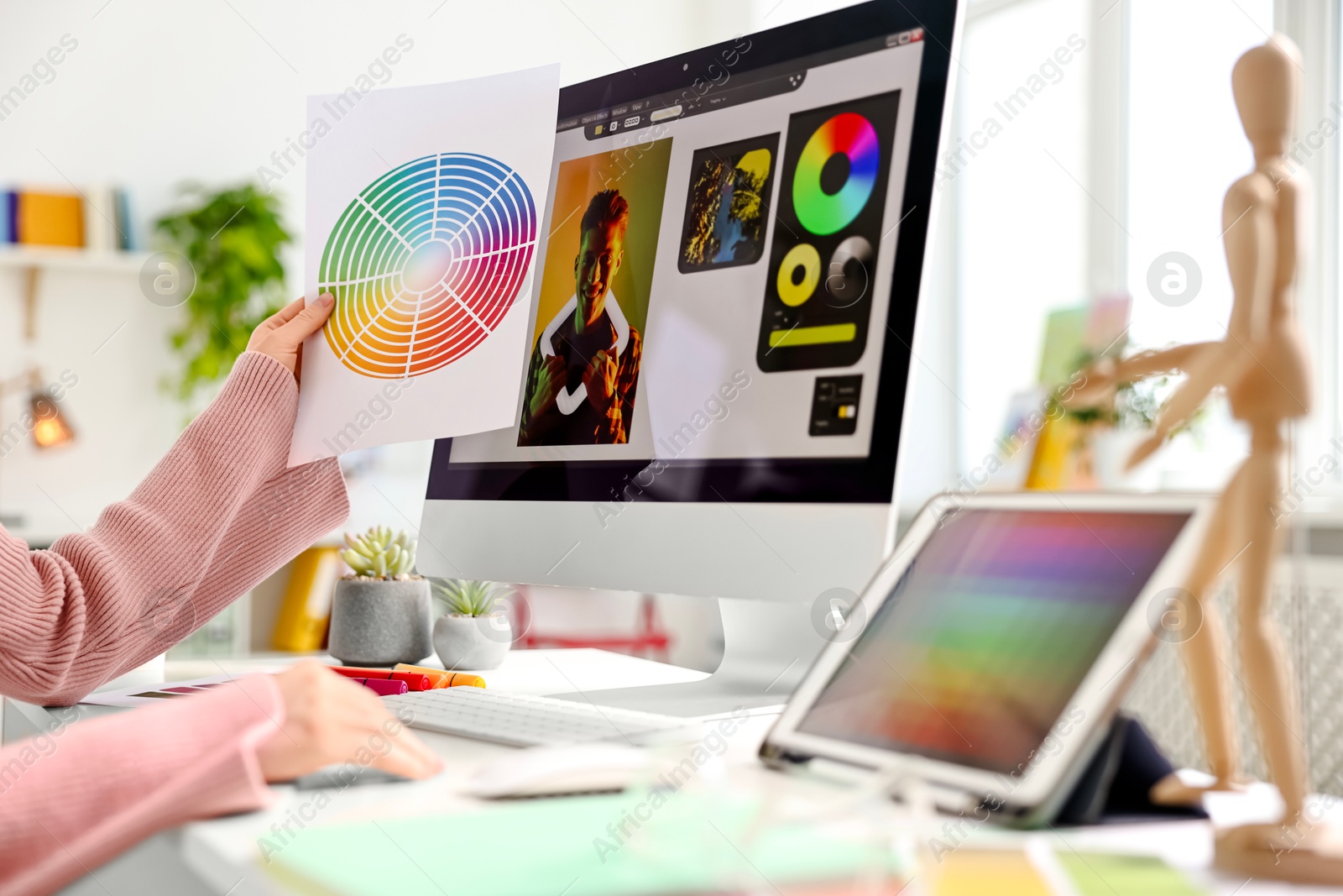 Photo of Designer working at table in office, closeup