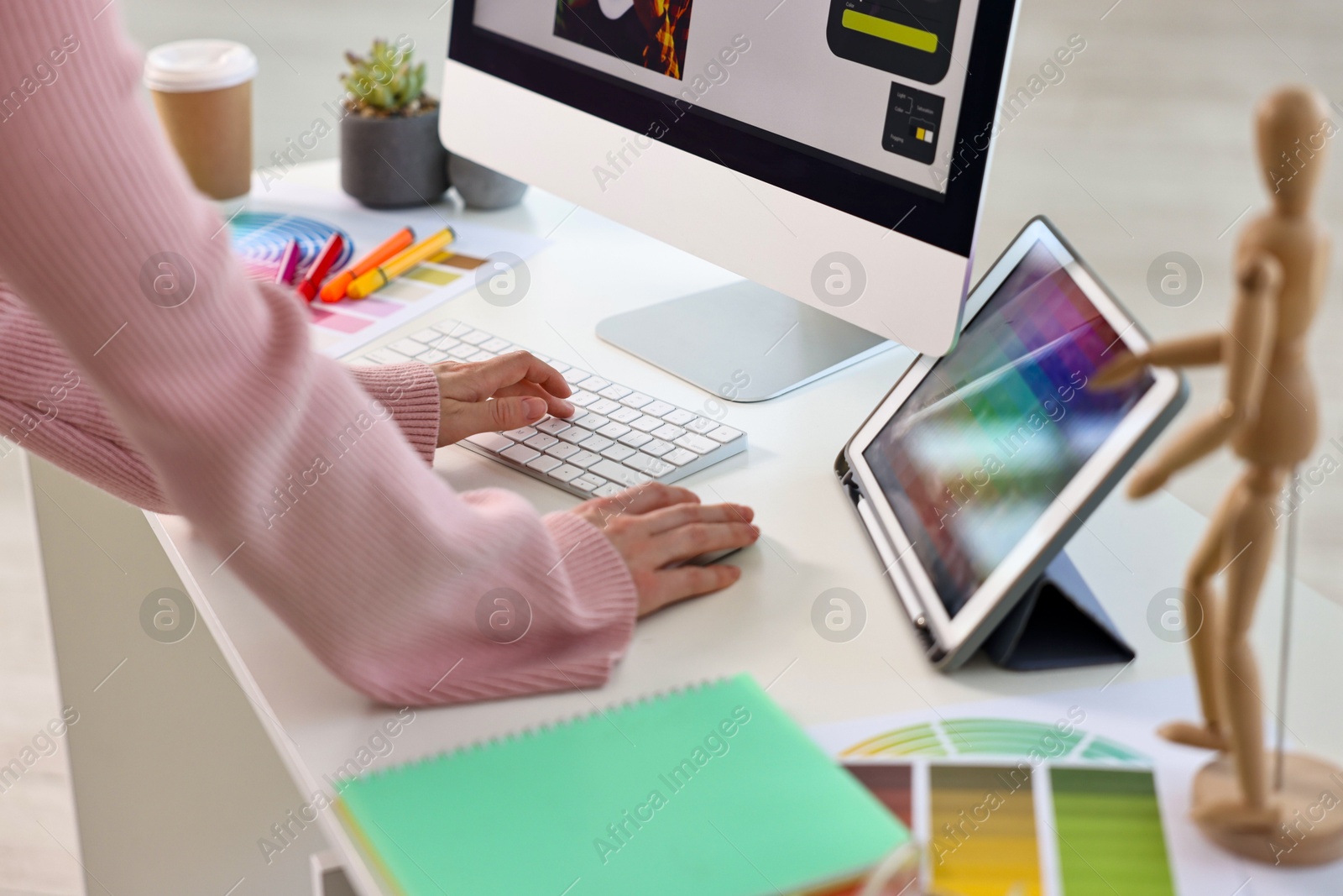 Photo of Designer working at table in office, closeup