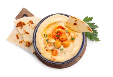 Delicious hummus with chickpeas and pita isolated on white, top view