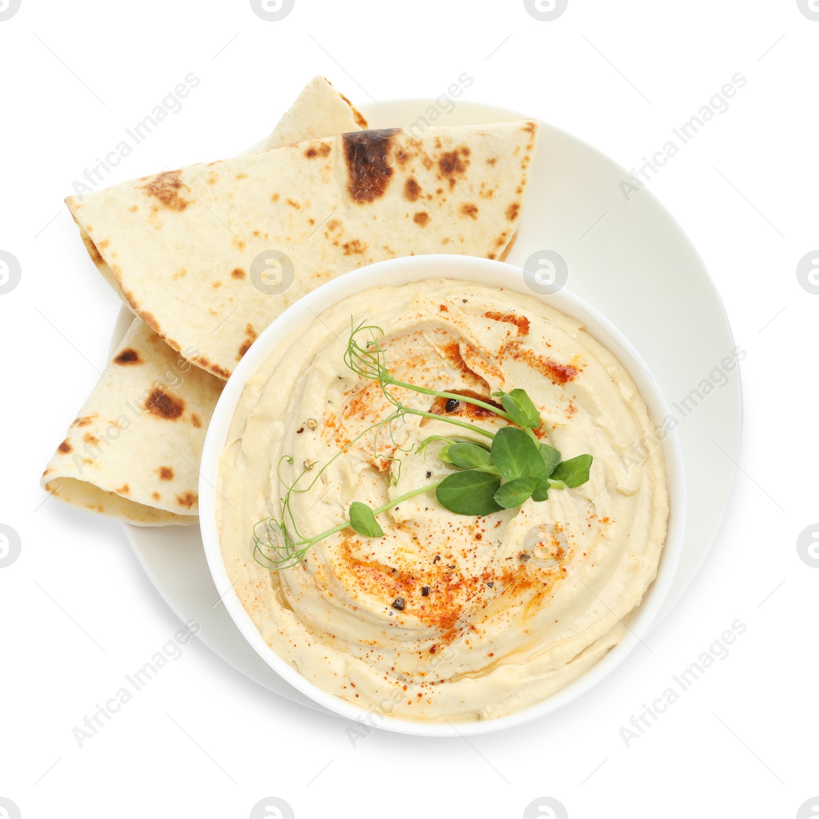 Photo of Delicious hummus with paprika and pita isolated on white, top view