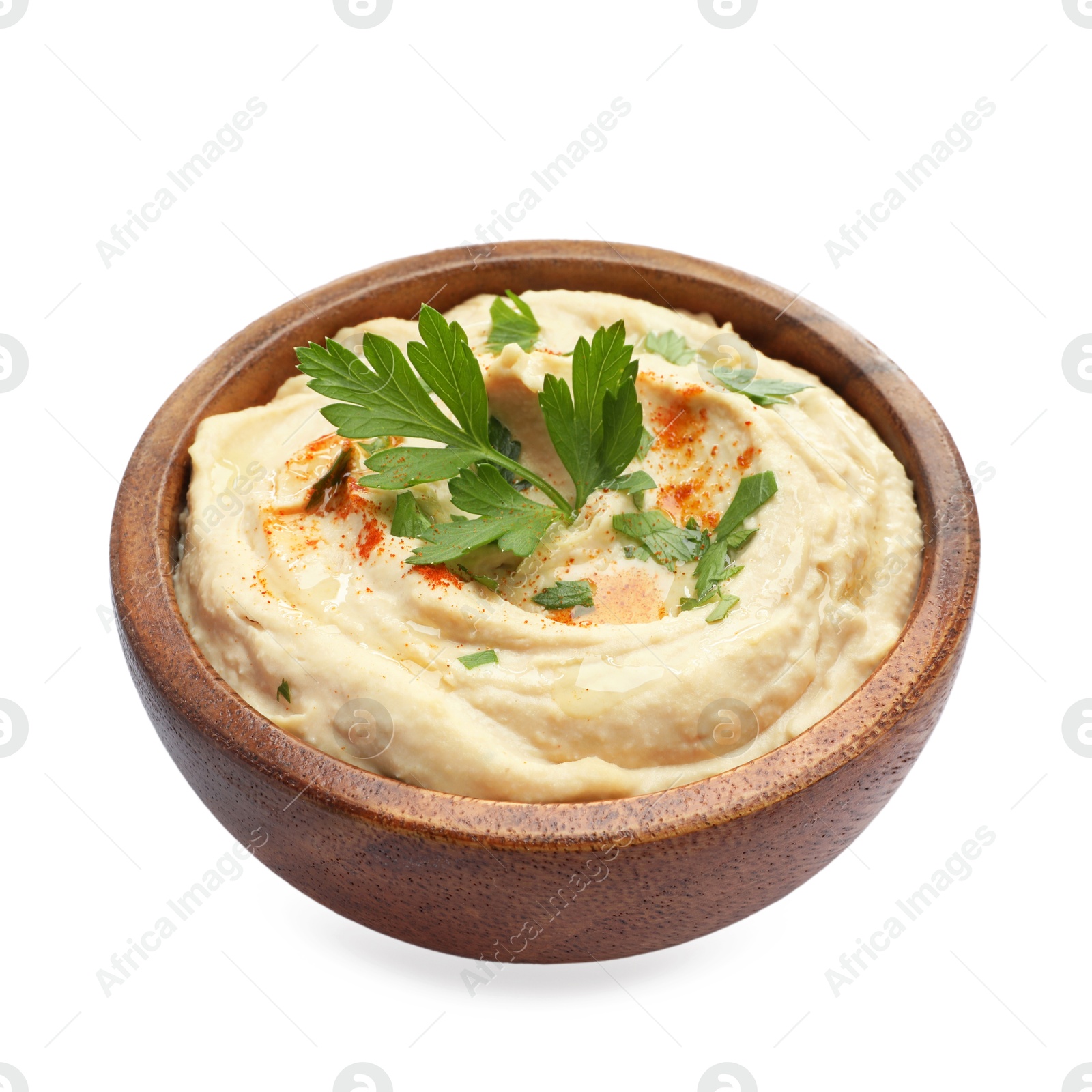 Photo of Delicious hummus with paprika and parsley in bowl isolated on white