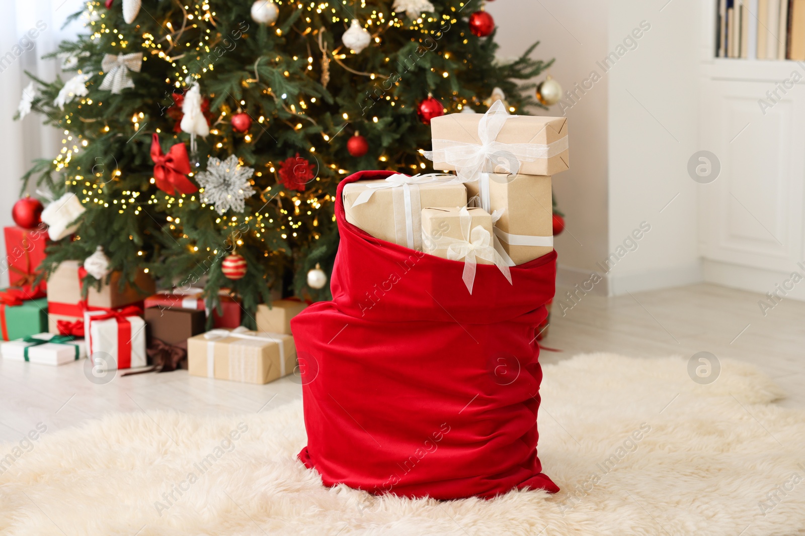 Photo of Santa bag full of Christmas presents at home