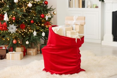 Photo of Santa bag full of Christmas presents at home