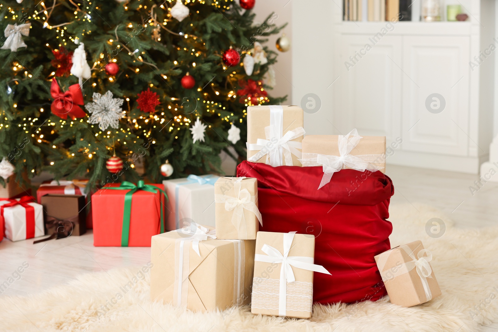 Photo of Santa bag full of Christmas presents at home