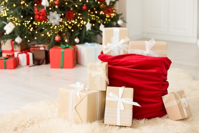 Photo of Santa bag full of Christmas presents at home