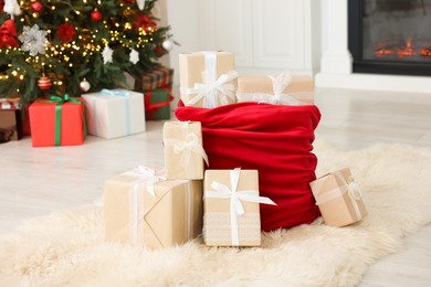 Photo of Santa bag full of Christmas presents at home