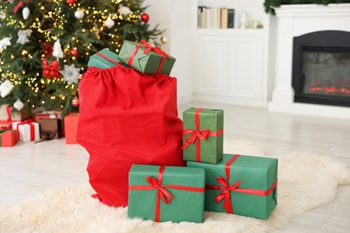 Photo of Santa bag full of Christmas presents at home