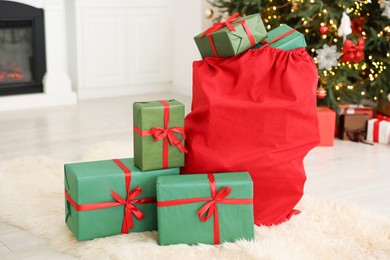 Photo of Santa bag full of Christmas presents at home