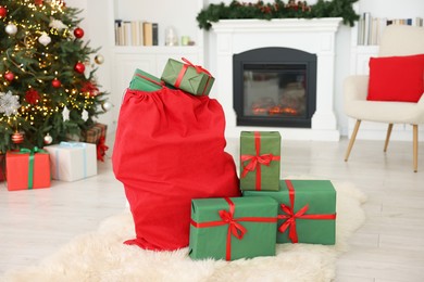 Photo of Santa bag full of Christmas presents at home