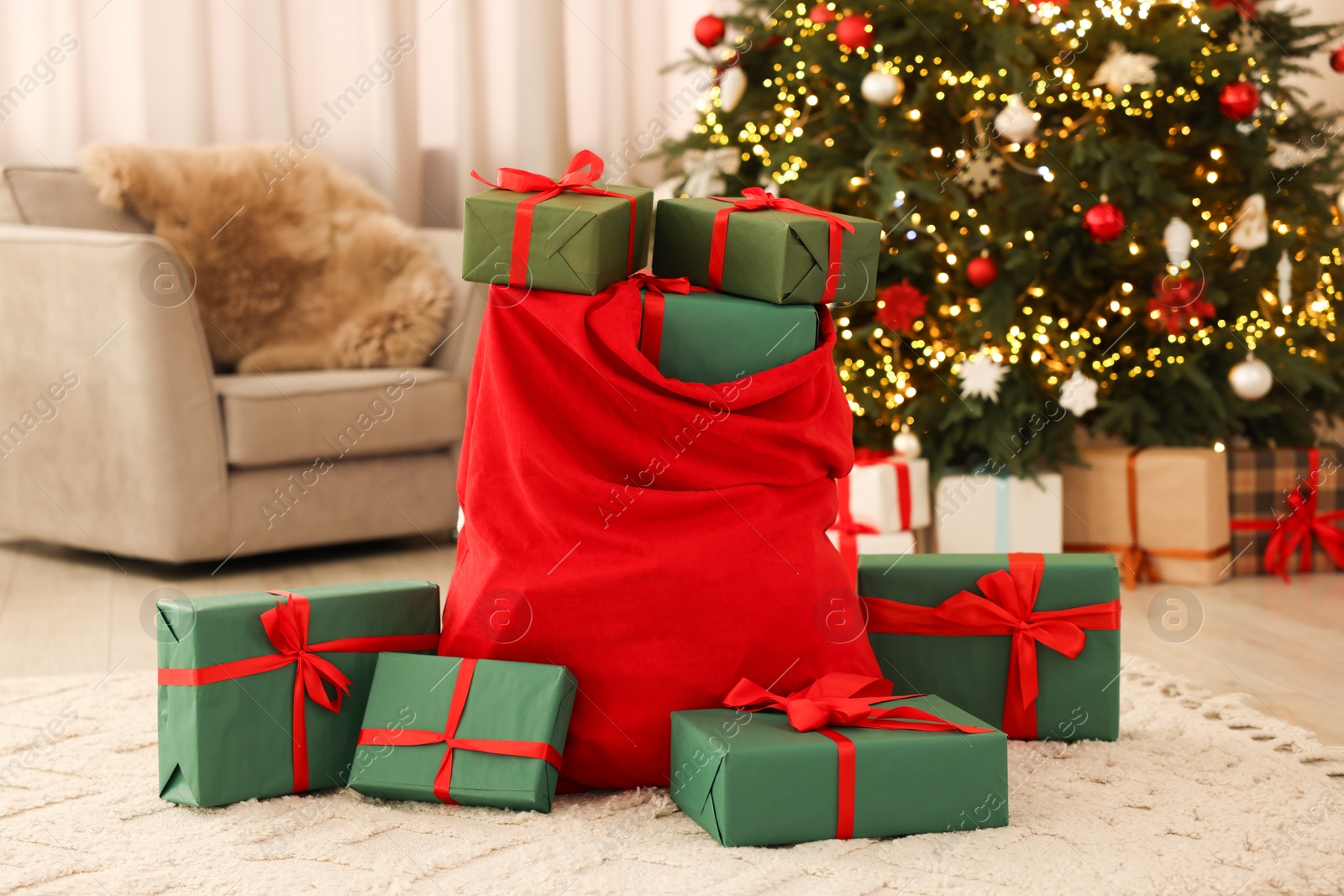 Photo of Santa bag full of Christmas presents at home