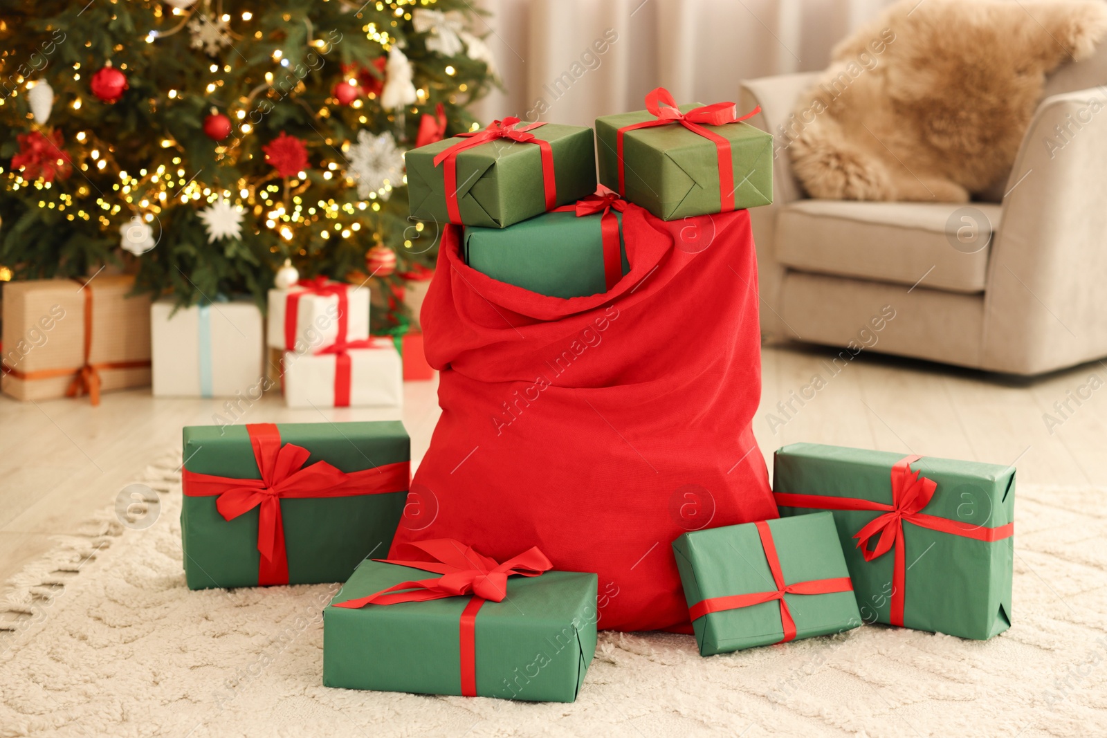 Photo of Santa bag full of Christmas presents at home