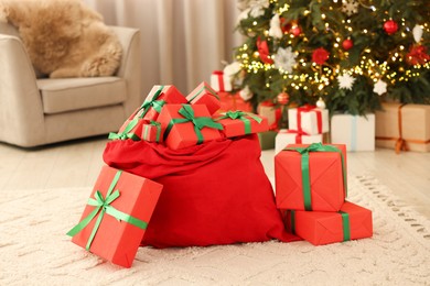 Photo of Santa bag full of Christmas presents at home