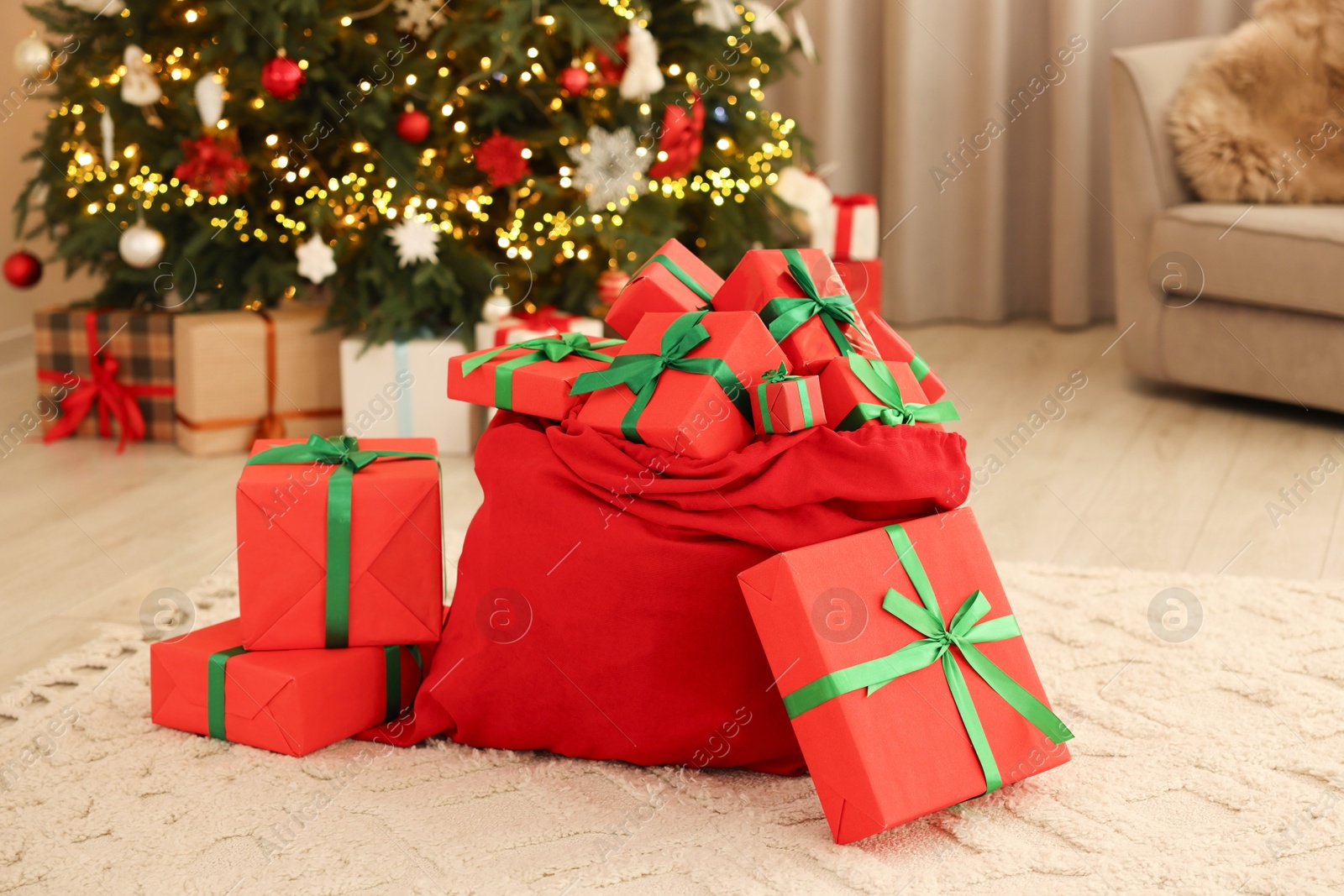 Photo of Santa bag full of Christmas presents at home