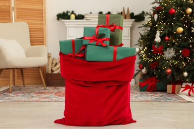 Photo of Santa bag full of Christmas presents at home