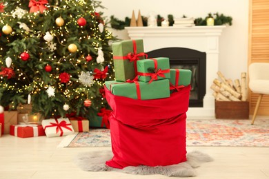 Photo of Santa bag full of Christmas presents at home