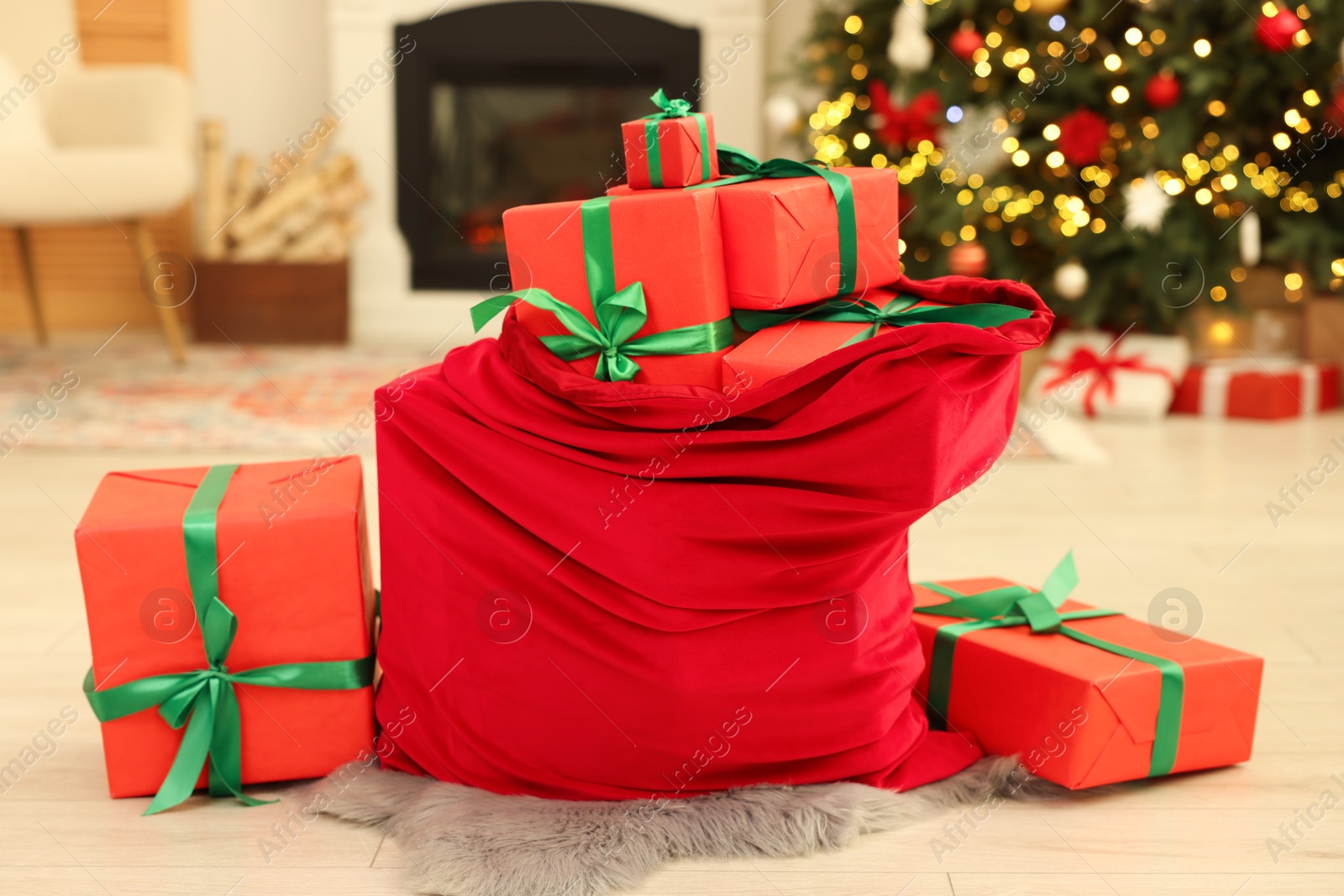 Photo of Santa bag full of Christmas presents at home