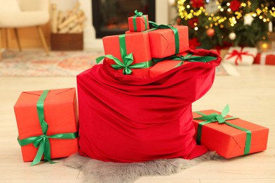 Photo of Santa bag full of Christmas presents at home