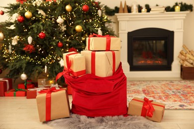 Photo of Santa bag full of Christmas presents at home