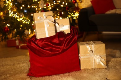 Photo of Santa bag full of Christmas presents at home