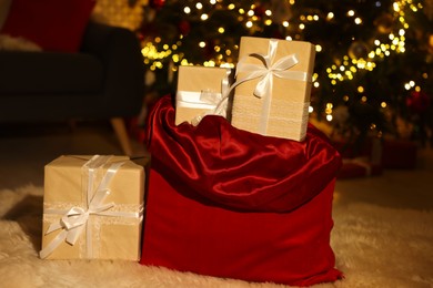 Photo of Santa bag full of Christmas presents at home