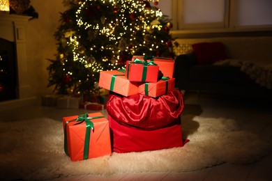 Photo of Santa bag full of Christmas presents at home