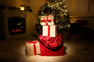 Photo of Santa bag full of Christmas presents at home