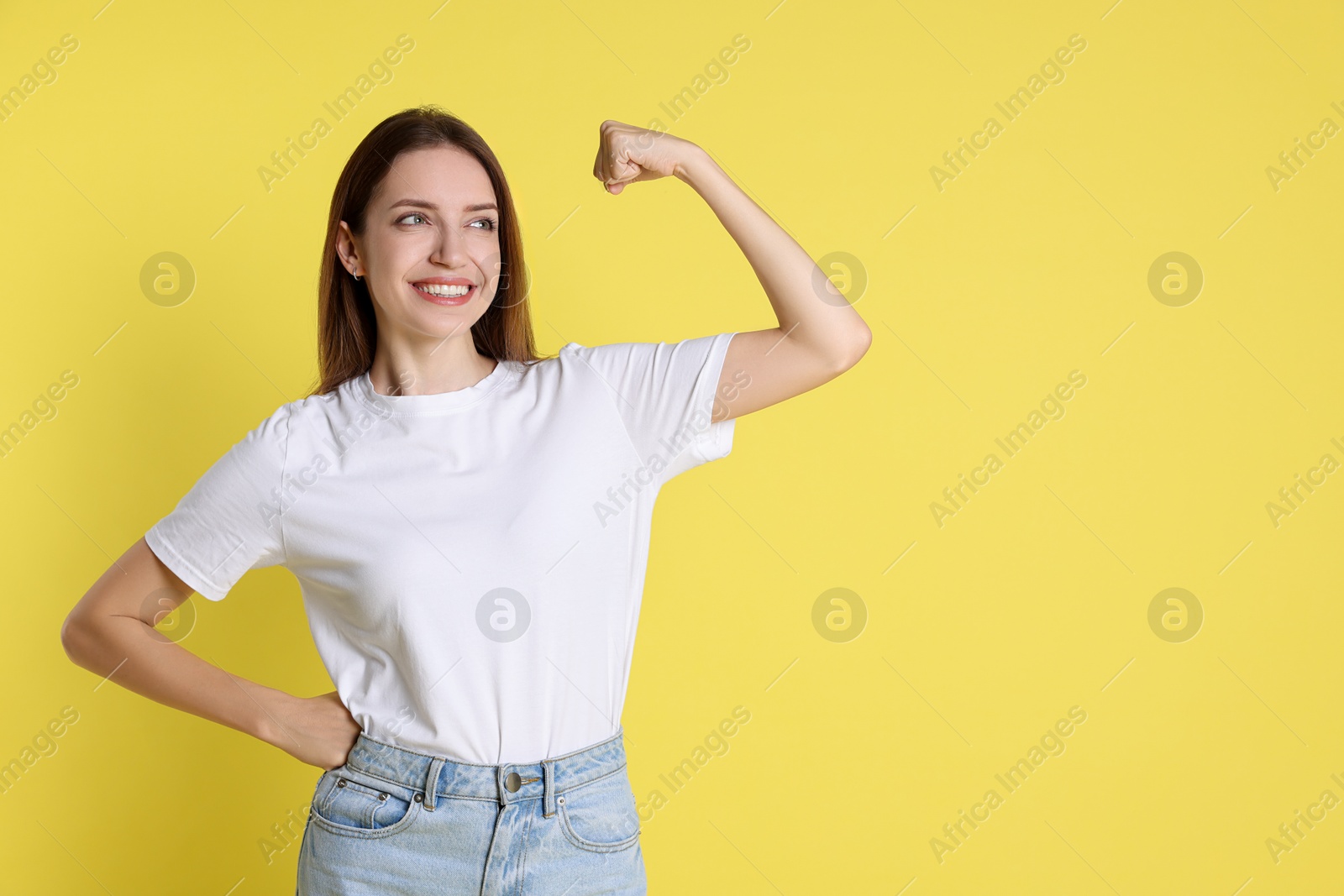 Photo of Happy winner on yellow background, space for text