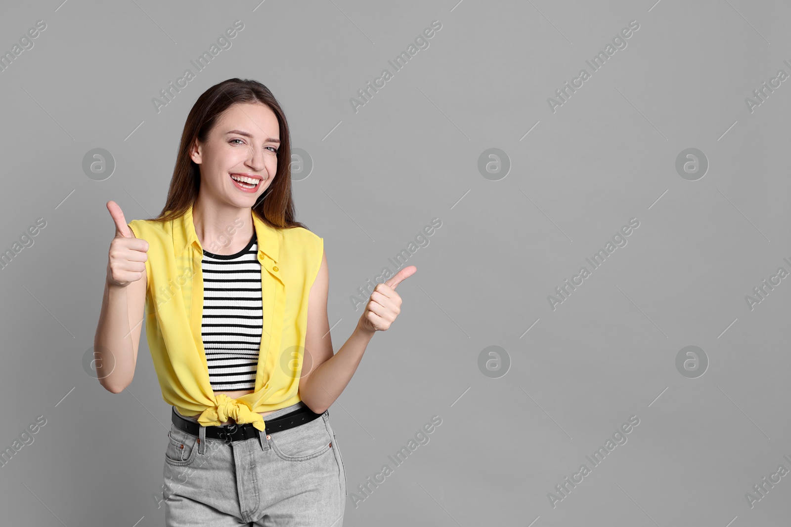 Photo of Happy winner on gray background, space for text