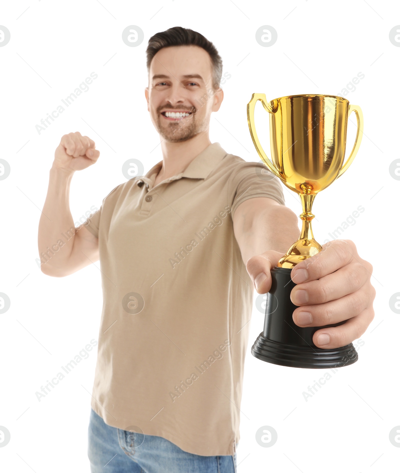 Photo of Happy winner with golden trophy cup on white background