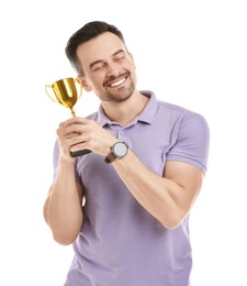 Photo of Happy winner with golden trophy cup on white background