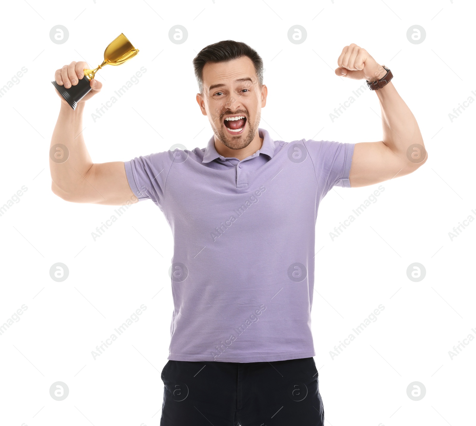 Photo of Happy winner with golden trophy cup showing his biceps on white background