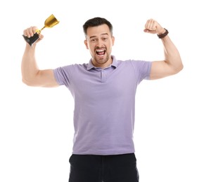 Happy winner with golden trophy cup showing his biceps on white background