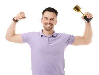 Photo of Happy winner with golden trophy cup showing his biceps on white background