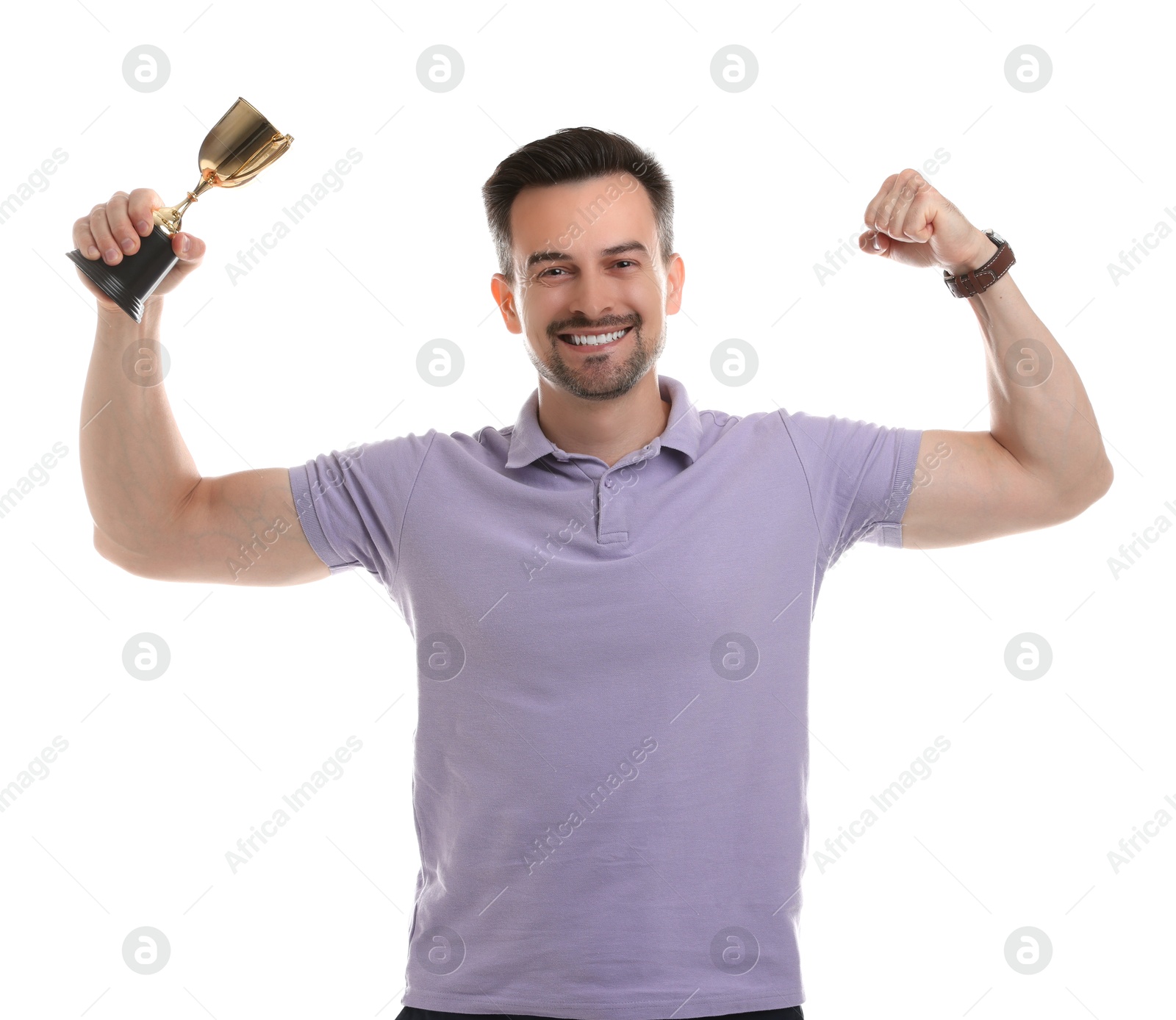 Photo of Happy winner with golden trophy cup showing his biceps on white background