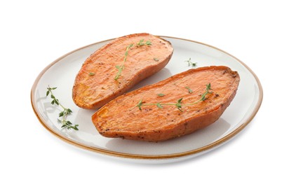 Photo of Halves of tasty cooked sweet potato with thyme isolated on white