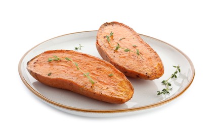 Photo of Halves of tasty cooked sweet potato with thyme isolated on white