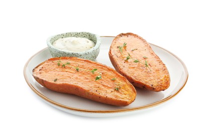 Photo of Halves of tasty cooked sweet potato with thyme and sauce isolated on white