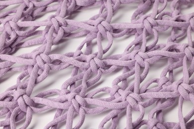 Photo of Handmade macrame shopping bag on white background, closeup