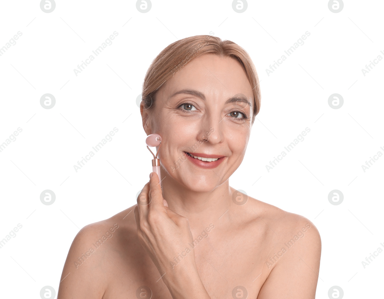 Photo of Smiling woman doing facial self massage with roller on white background