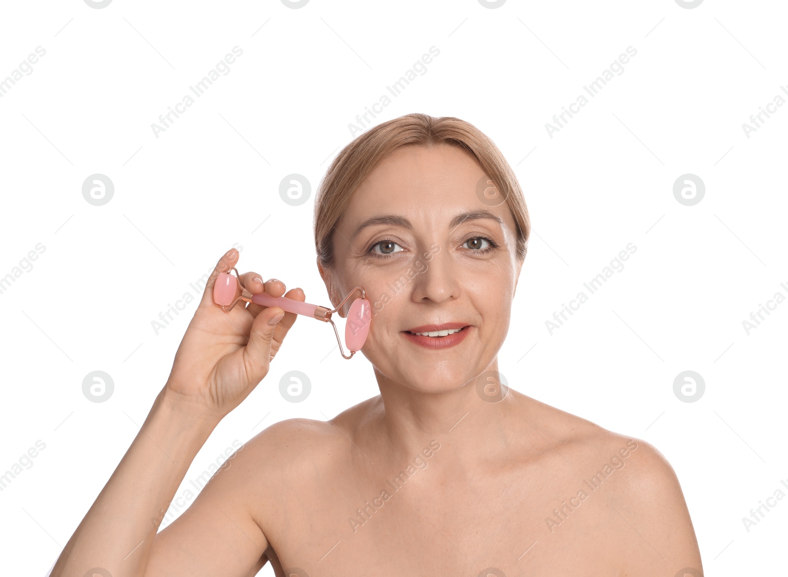 Photo of Smiling woman doing facial self massage with roller on white background