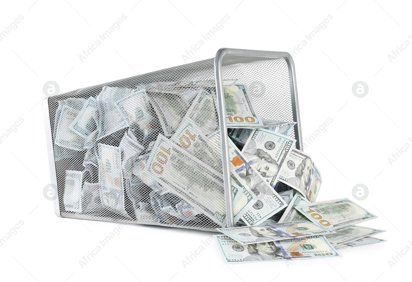 Photo of Many dollar banknotes and overturned trash bin isolated on white